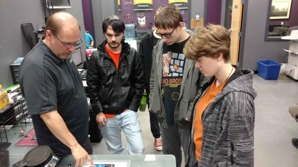 High school students getting a tour of a local business.