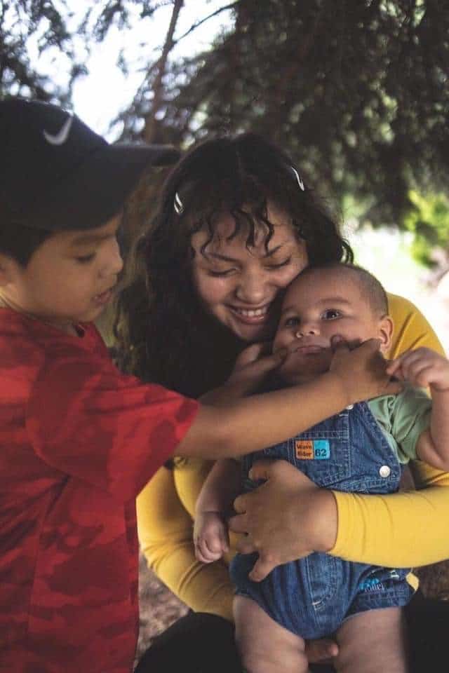 SkillSource client Paulina and her two young children.