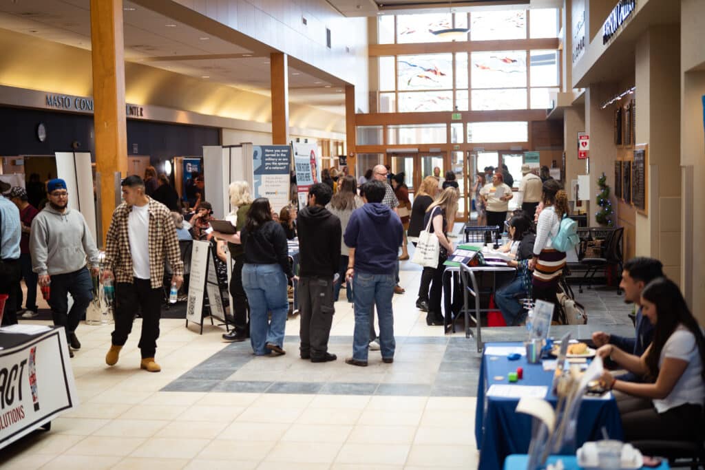 The hallway at Big Bend Community College&#039;s Job Fair full of interactions from multiple partners to young adults