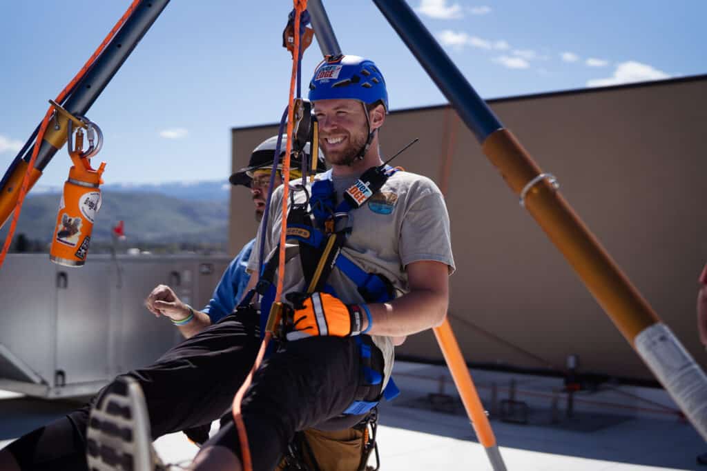 Man getting ready to rappel off the Residence Inn Building