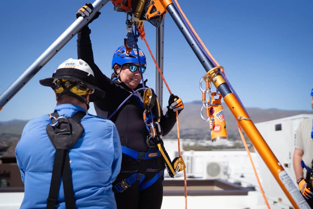 Woman getting ready to Rappel off the Residence Inn Building
