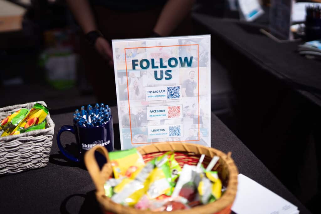 A flyer with &quot;Follow Us&quot; as a heading and social media QR codes