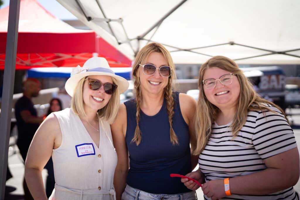 3 ladies smiling at the camera